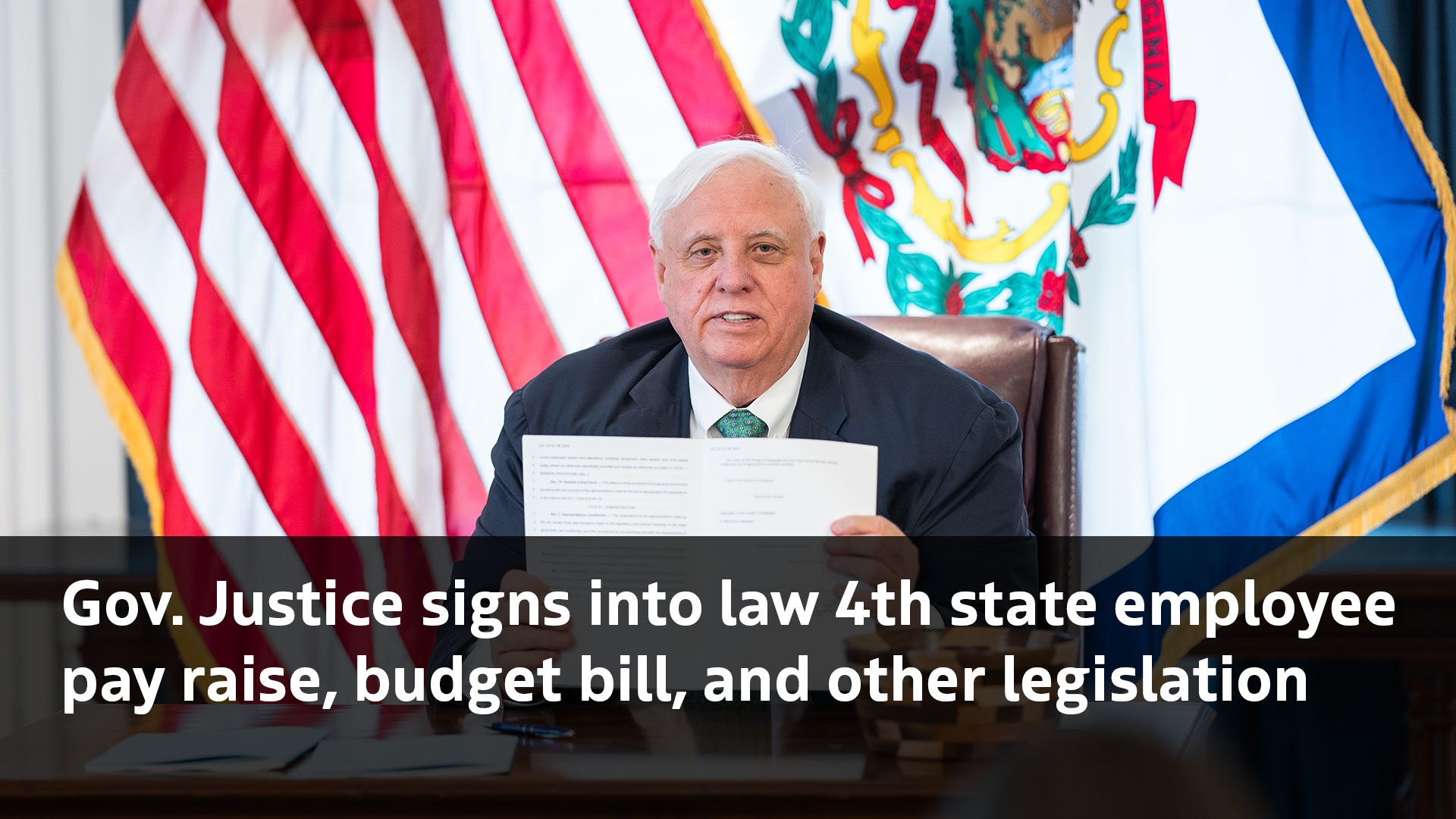 Gov. Justice signs into law 4th state employee pay raise, budget bill
